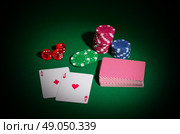Playing chips dices and cards on green table. Стоковое фото, агентство Ingram Publishing / Фотобанк Лори