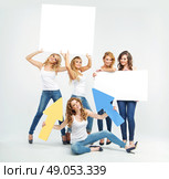 Attractive and cheerful ladies promoting something. Стоковое фото, агентство Ingram Publishing / Фотобанк Лори