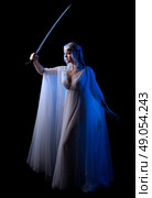 Young elven girl with sword isolated on black. Стоковое фото, агентство Ingram Publishing / Фотобанк Лори