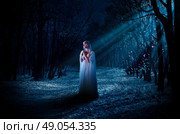 Young elven girl in night forest. Стоковое фото, агентство Ingram Publishing / Фотобанк Лори