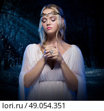 Young elven girl at night forest. Стоковое фото, агентство Ingram Publishing / Фотобанк Лори