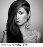 Portrait of beautiful young woman with earring. Jewelry and accessories. Perfect makeup. Fashion photo. Стоковое фото, агентство Ingram Publishing / Фотобанк Лори