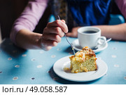 A woman is having coffee and cake in a tearoom. Стоковое фото, агентство Ingram Publishing / Фотобанк Лори