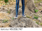 The legs of a young woman standing on a mound of dirt. Стоковое фото, агентство Ingram Publishing / Фотобанк Лори