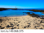 El Cotillo beach and Toston lighthouse at Fuerteventura Canary Islands. Стоковое фото, агентство Ingram Publishing / Фотобанк Лори