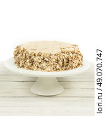 Cake with almonds and nougat creme on a wooden table. Стоковое фото, агентство Ingram Publishing / Фотобанк Лори