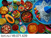 Mexican food mix colorful background Mexico and sombrero. Стоковое фото, агентство Ingram Publishing / Фотобанк Лори