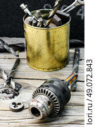 Cartridge for fastening the drill from the drill and set of drill bits. Set of tools to work with. Стоковое фото, агентство Ingram Publishing / Фотобанк Лори
