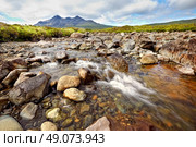 view on Sgurr nan Gillean, Am Basteir and Sgurr a Bhasteir from Sligachan River, Isle of Skye, Scotland. Стоковое фото, агентство Ingram Publishing / Фотобанк Лори
