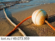 buoy on the beach at sunrise. Стоковое фото, агентство Ingram Publishing / Фотобанк Лори