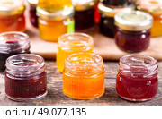 various jars of fruit jam on wooden table. Стоковое фото, агентство Ingram Publishing / Фотобанк Лори