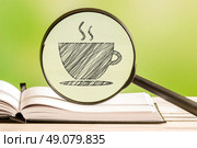 Coffee search with a pencil drawing of a coffee cup in a magnifying glass. Стоковое фото, агентство Ingram Publishing / Фотобанк Лори