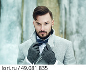 Outdoor portrait of handsome man in gray coat. Fashion photo. Beauty winter style. Стоковое фото, агентство Ingram Publishing / Фотобанк Лори