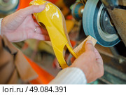 Grinding heel of a shoe. Стоковое фото, агентство Ingram Publishing / Фотобанк Лори