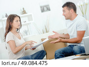 Couple discussing bills. Стоковое фото, агентство Ingram Publishing / Фотобанк Лори