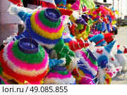 Mexican party pinatas decorated with fringed tissue colorful paper. Стоковое фото, агентство Ingram Publishing / Фотобанк Лори