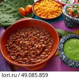 Frijoles mexican beans with rice and sauces nopal and pico de gallo. Стоковое фото, агентство Ingram Publishing / Фотобанк Лори