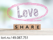 Share love sign with a word in a sketched circle. Стоковое фото, агентство Ingram Publishing / Фотобанк Лори