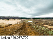 Iceland landscape with mountains in the horizont and cloudy weather. Стоковое фото, агентство Ingram Publishing / Фотобанк Лори