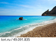 Cala del Moraig beach in Benitatxell of Alicante in Spain. Стоковое фото, агентство Ingram Publishing / Фотобанк Лори