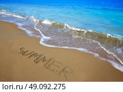 Summer spell written word in sand of a beach in vacation. Стоковое фото, агентство Ingram Publishing / Фотобанк Лори