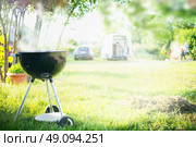 Grill with smoke over summer  outdoor nature in garden or park, outdoor, close up. Стоковое фото, агентство Ingram Publishing / Фотобанк Лори