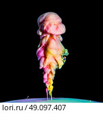 Colored inks in water on black background, flipped over view. Стоковое фото, агентство Ingram Publishing / Фотобанк Лори