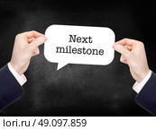Next Milestone written on a speechbubble. Стоковое фото, агентство Ingram Publishing / Фотобанк Лори