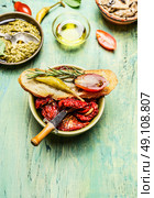 Italian antipasto snack with ciabatta bread pesto, tomatoes and peperoni , close up. Стоковое фото, агентство Ingram Publishing / Фотобанк Лори