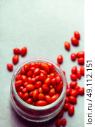 Goji berries in glass jar ,close up. Стоковое фото, агентство Ingram Publishing / Фотобанк Лори