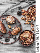 harvest of autumn mushrooms. Plate collected in the forest boletus mushrooms on wooden background. Стоковое фото, агентство Ingram Publishing / Фотобанк Лори