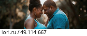 Overweight man and a woman are standing close to each other in an intimate pose, facing each other. Стоковое AI-изображение, AI-художник Данила Большаков / Фотобанк Лори
