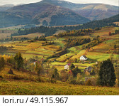 Autumn garden in Carpathian mountains. Orchard on the fall hills. Стоковое фото, агентство Ingram Publishing / Фотобанк Лори