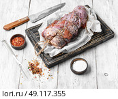 meat prepared for jerky. Beef rolled into knuckle in seasoning and spices. Стоковое фото, агентство Ingram Publishing / Фотобанк Лори