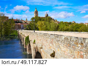 Salamanca skyline and roman bridge over Tormes river in Spain. Стоковое фото, агентство Ingram Publishing / Фотобанк Лори