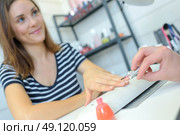 polishing the fingernails. Стоковое фото, агентство Ingram Publishing / Фотобанк Лори
