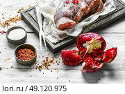 Meat knuckle ,soaked in pomegranate sauce and spices. Стоковое фото, агентство Ingram Publishing / Фотобанк Лори