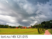 Summer storm landscape. Dramatic cloudy sky. Hurricane and rain in Belarus. Стоковое фото, агентство Ingram Publishing / Фотобанк Лори