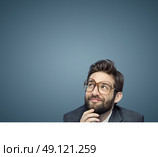 Portrait of an employee consider his own business. Стоковое фото, агентство Ingram Publishing / Фотобанк Лори