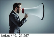 Conceptual photo of manager yelling over the megaphone. Стоковое фото, агентство Ingram Publishing / Фотобанк Лори