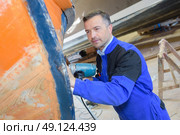 inspecting the boat hull. Стоковое фото, агентство Ingram Publishing / Фотобанк Лори