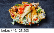 Pancakes for Shrove Tuesday. panorama of pancakes stuffed with meat and mushrooms on the plate. Стоковое фото, агентство Ingram Publishing / Фотобанк Лори