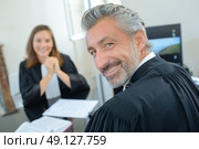 Portrait of male and female lawyers in robes. Стоковое фото, агентство Ingram Publishing / Фотобанк Лори
