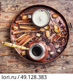 coffee and many coffee spices. cezve and cup of coffee in copper tray with oriental spices. Стоковое фото, агентство Ingram Publishing / Фотобанк Лори