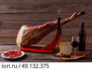 Iberian ham pata negra from Spain manchego cheese and red wine. Стоковое фото, агентство Ingram Publishing / Фотобанк Лори