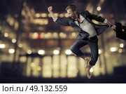 Handsome and young businessman achieving a success. Стоковое фото, агентство Ingram Publishing / Фотобанк Лори