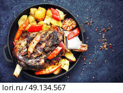Roast mutton in the pan. Mutton cooked in a pan with potatoes and vegetables. Стоковое фото, агентство Ingram Publishing / Фотобанк Лори