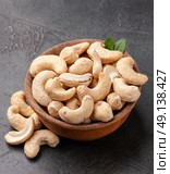 Cashew nuts in wooden plate. Стоковое фото, фотограф Волошина Мария Ивановна / Фотобанк Лори