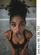 A woman with her mouth wide open, making a comical and silly expression. Стоковое AI-изображение, AI-художник Данила Большаков / Фотобанк Лори