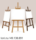 Wooden Easel Set. Wooden easel set with blank white canvases represented from different sides isolated vector illustration. Стоковая иллюстрация, агентство Ingram Publishing / Фотобанк Лори